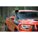 Red truck driving down dirt road with ARB Safari 4x4 Snorkel displayed