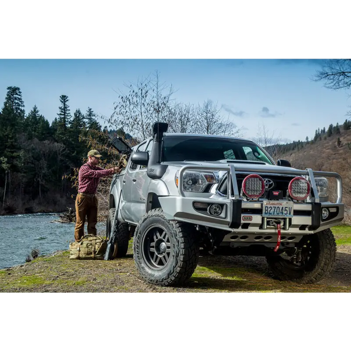 ARB Safari 4X4 Snorkel on Silver Toyota Tacoma Truck with Man