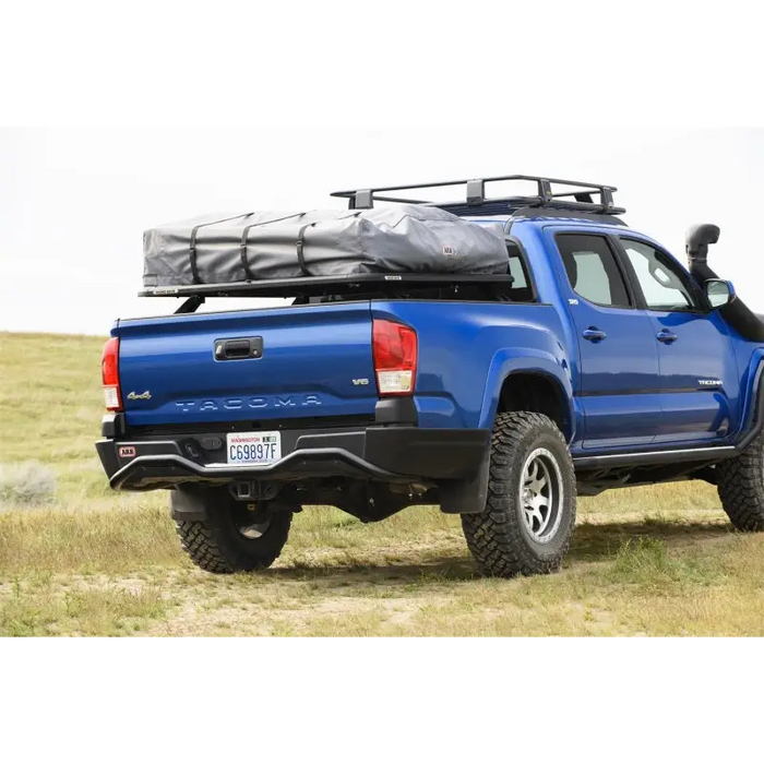 Blue ARB Summit Rstb Integrit Tacoma 16On truck with black roof rack