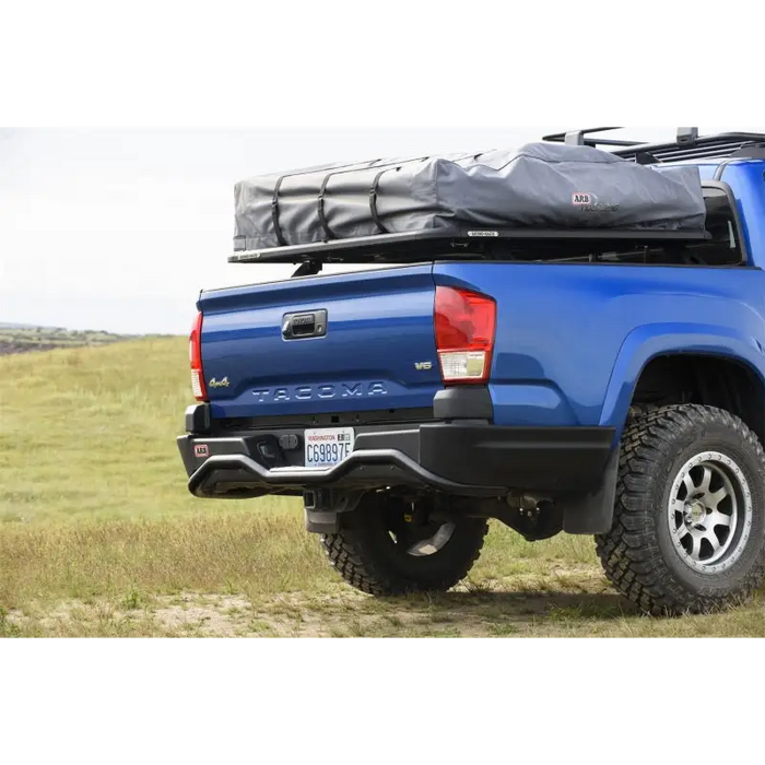 Blue truck with large bag on back - ARB Summit Rstb Integrit Tacoma 16On