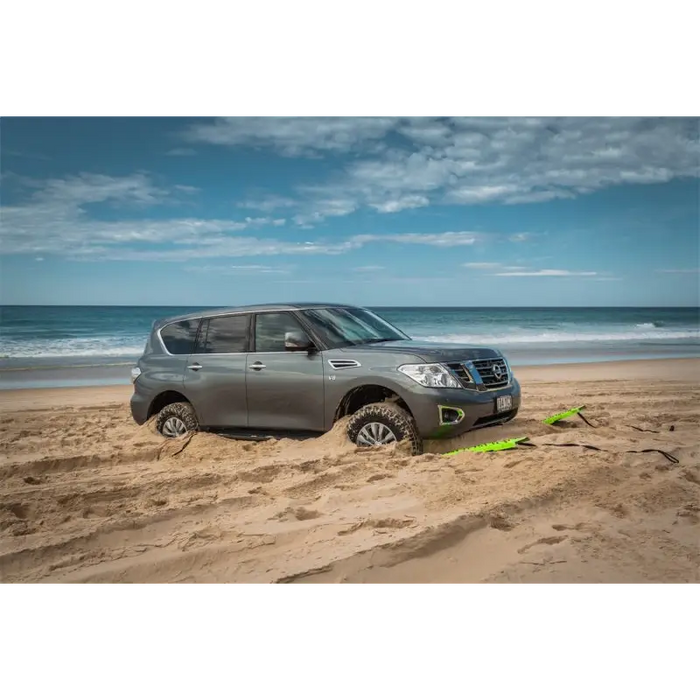 Nissan SUV parked on beach next to ARB Tred Leash 1500 with handle