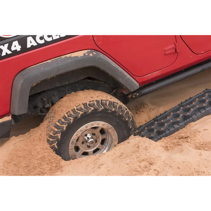 Red Jeep with Mud Tire - ARB Tred Pro Mon Grey/Orange Board