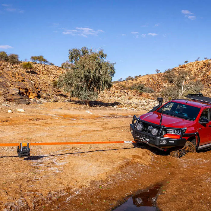 Red car parked on dirt road - ARB Weekender Recovery Kit - 17600lb Recovery Strap/4.75T Shackles.