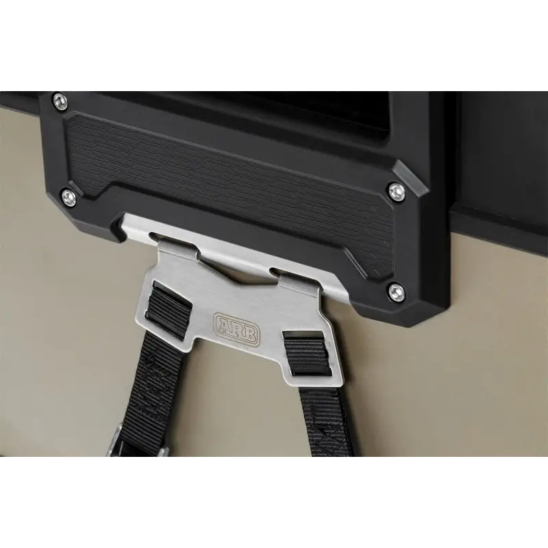 Black and white wall mounted TV next to ARB Zero Fridge Freezer Tie Down Kit (For arb10802602)