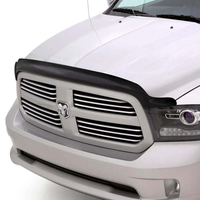 Front view of white dodge ram featuring avs bugflector high profile hood shield - smoke