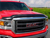 Red truck parked in parking lot with avs bugflector ii hood shield - car wash safe