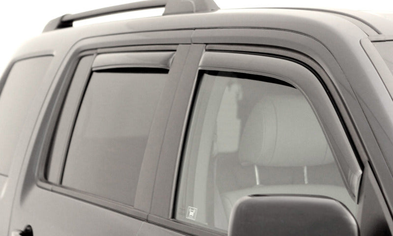 Black van with white background showcasing avs 03-09 toyota 4runner ventvisor in-channel front & rear window deflectors - smoke