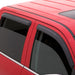 Red car with black roof rack featuring avs original ventvisor window deflectors for toyota 4runner - smoke
