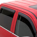 Red car with black roof rack featuring avs original ventvisor window deflectors for fresh air