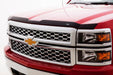 Red truck with black grill featuring avs aeroskin low profile hood shield - matte black, special hardware required