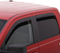 Red van with black roof rack on avs 05-15 toyota tacoma access cab ventvisor low profile deflectors - smoke