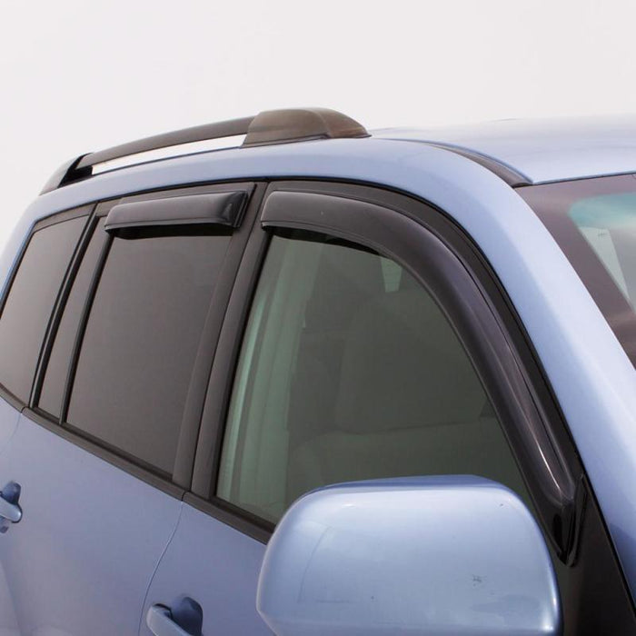 Blue car with black roof rack featuring avs ventvisor outside mount window deflectors for fresh air