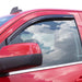 Red car with sky reflection on side window, avs toyota fj cruiser in-channel window deflectors - smoke