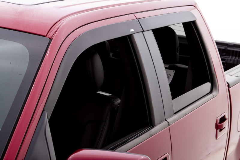 Red truck with black roof rack - avs low profile window deflector for toyota fj cruiser