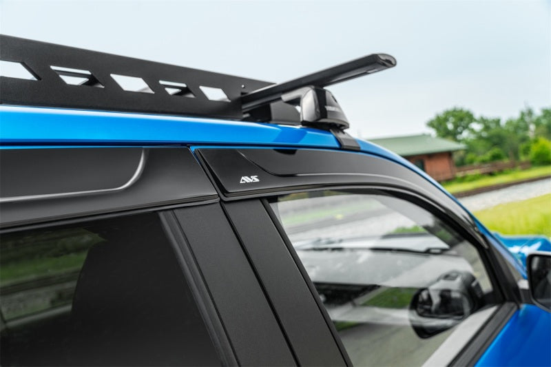 Toyota fj cruiser with low profile window deflector roof rack for fresh air