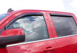 Red car reflected in avs 07-18 jeep patriot ventvisor in-channel front & rear window deflectors aiding fresh air circulation