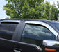 Black suv parked in parking lot next to avs jeep patriot ventvisor rear window deflectors 4pc - chrome