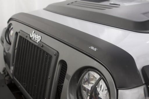 Matte black avs aeroskin hood shield for jeep wrangler unlimited, front end view with light