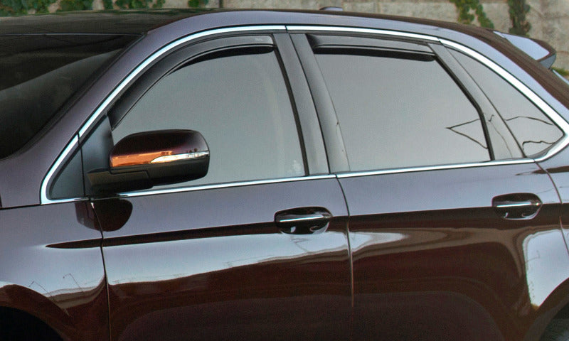 Brown car parked in front of stone wall with avs jeep wrangler unlimited ventvisor in-channel window deflectors - smoke