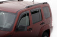 Red van with roof rack featuring avs original ventvisor window deflectors for fresh air