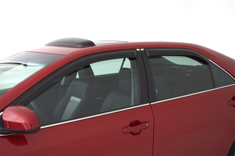 Red car parked with avs original ventvisor window deflectors for fresh air