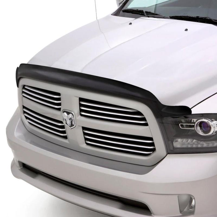Front view of white dodge ram with avs bugflector ii hood shield - smoke