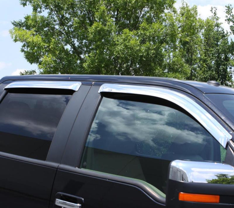 Black suv parked in a parking lot with toyota 4runner ventvisor rear window deflectors
