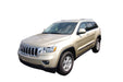 Beige jeep with avs 11-18 jeep grand cherokee ventvisor window deflectors on white background