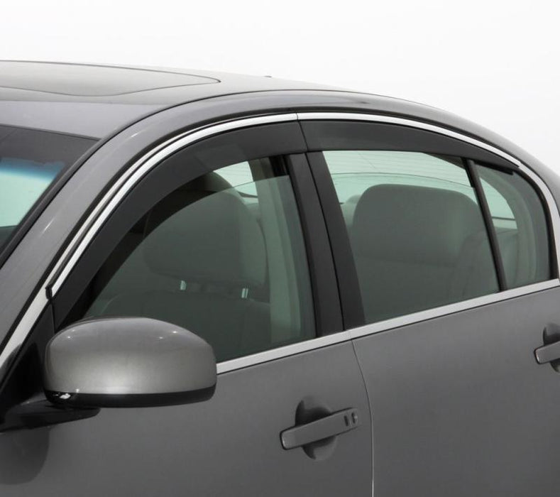 Avs low profile window deflector for jeep grand cherokee - smoke w/chrome trim - close up of car side mirror and door handle