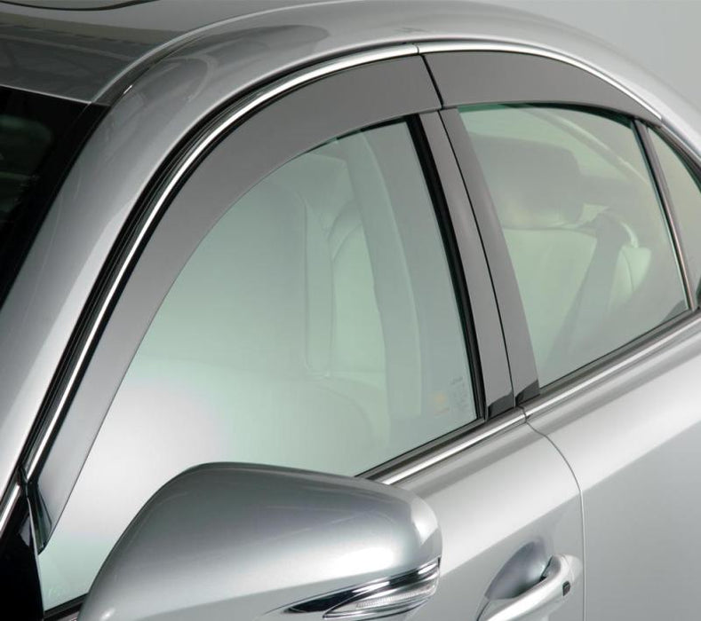 Silver car with black roof featuring avs low profile window deflectors for jeep grand cherokee