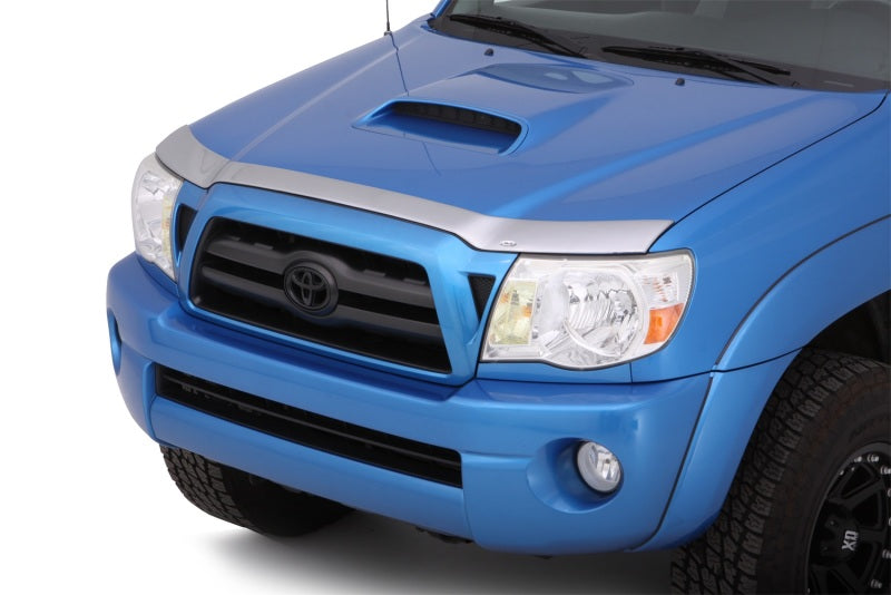 Blue toyota tacoma truck with avs aeroskin low profile hood shield in chrome - special hardware required