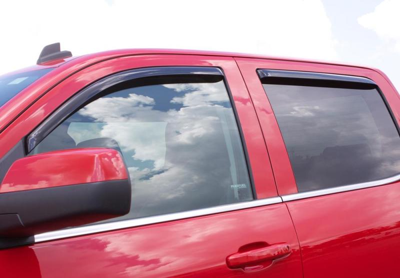 Red car with cloudy sky reflected in avs window deflectors, providing fresh air flow