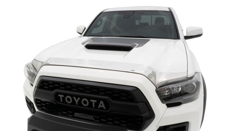 Front end of white toyota tacoma with avs aeroskin low profile hood shield - chrome. Special hardware required