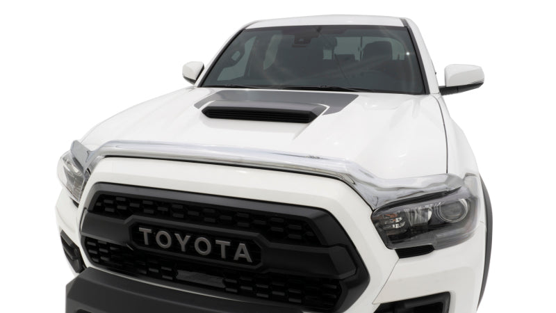 Front view of a white toyota tacoma truck with avs chrome hood shield