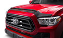 Front end of a red 2019 toyota tacoma with avs aeroskin lightshield pro in black