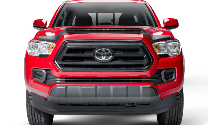 Front end view of a red 2019 toyota tacoma with avs aeroskin lightshield pro - black