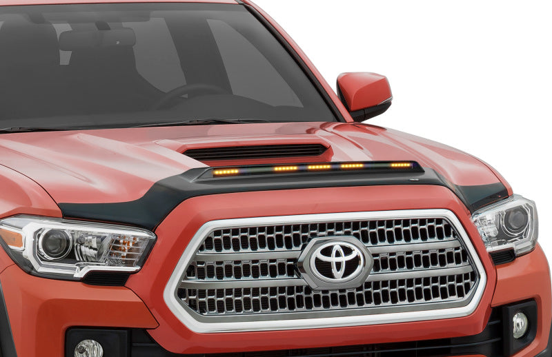 Front end of red toyota tacoma with hood protector and led marker lights - avs 2016-2019 toyota tacoma aeroskin in black