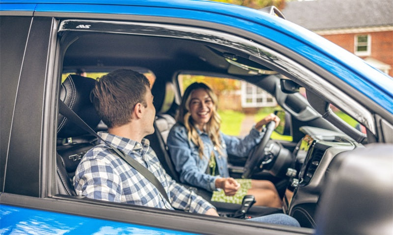 Couple driving a car with avs 2018 jeep wrangler unlimited window deflectors