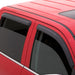 Red jeep wrangler unlimited with black roof rack- avs mount window deflectors