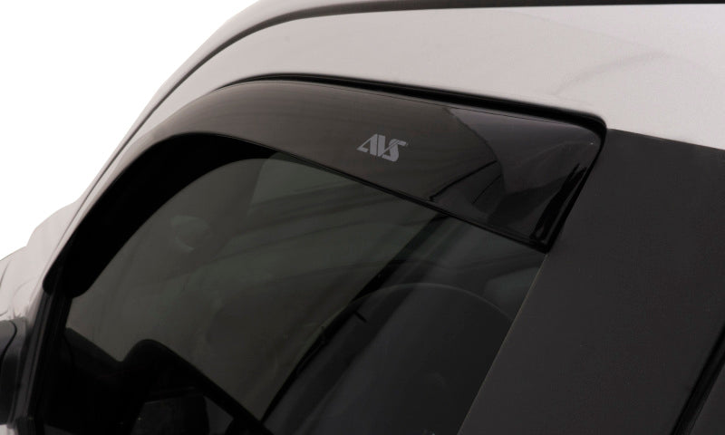 White car with black roof featuring avs toyota tacoma access cab ventvisor in-channel window deflectors providing fresh air