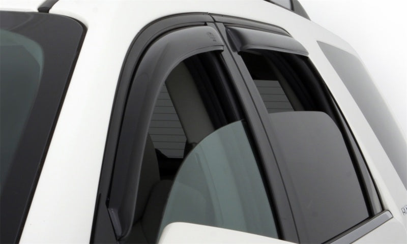 White car with black roof rack using avs window deflectors for fresh air