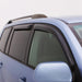 Blue car with black roof rack featuring avs 96-02 toyota 4runner ventvisor outside mount window deflectors for fresh air