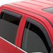 Red car with black roof rack featuring avs 96-02 toyota 4runner ventvisor outside mount window deflectors for fresh air