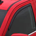 Red car with black roof featuring avs in-channel ventvisor window deflectors for fresh air