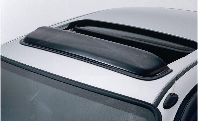 Black roof rack on a car with avs universal windflector classic sunroof wind deflector