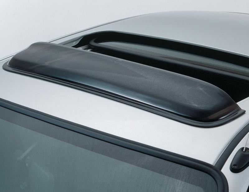 Close up of car with roof rack featuring avs universal windflector classic sunroof wind deflector - smoke