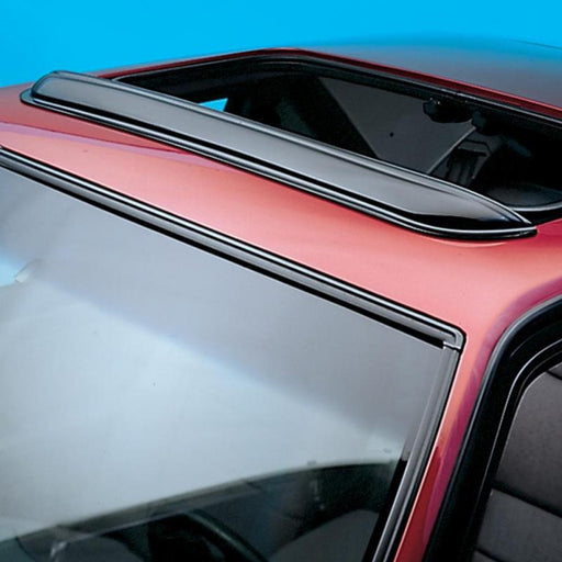 Red car with black roof using avs universal windflector pop-out sunroof wind deflector - smoke