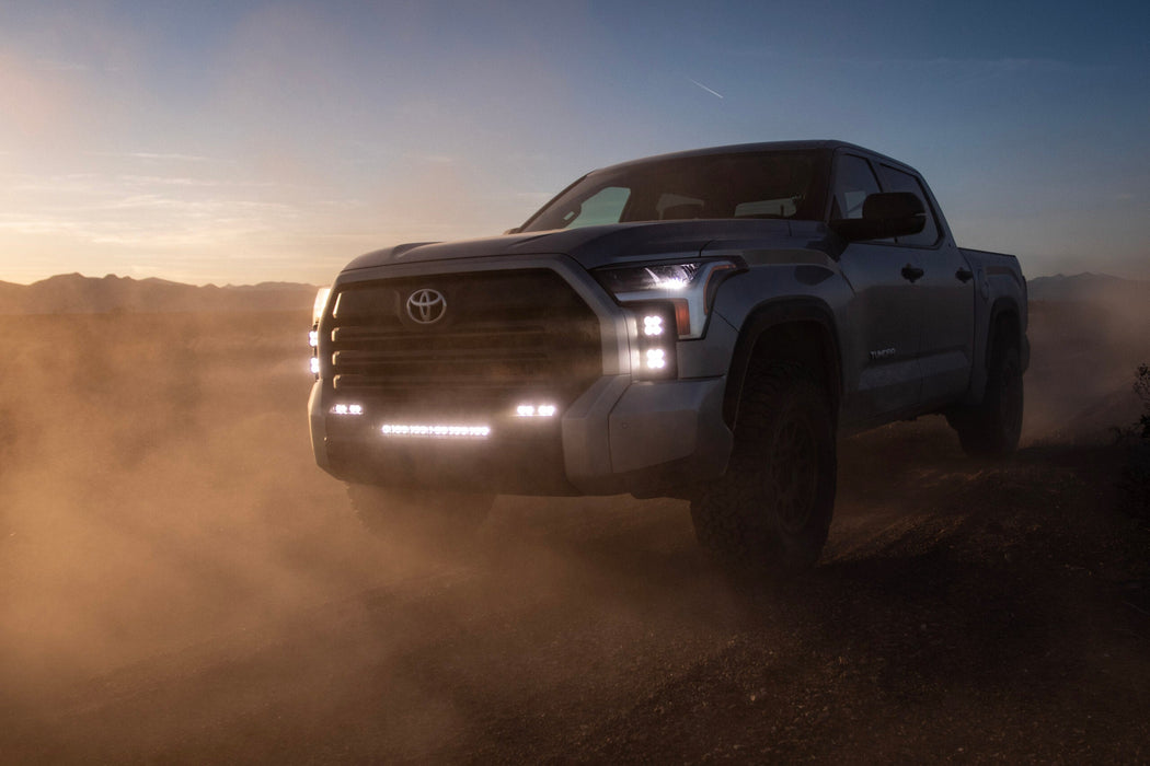 White toyota tundra squadron pro driving in desert