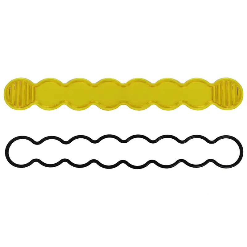 Yellow plastic hair clips against white background