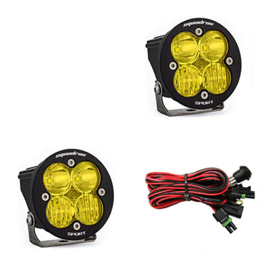 Pair of yellow Baja Designs Squadron R Sport LED light pods for motorcycle lights